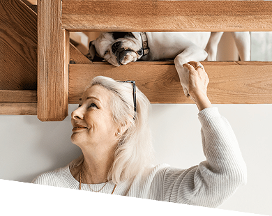 Woman with dog on ladder