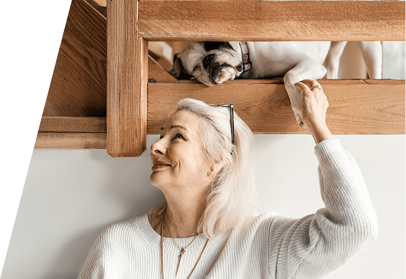 Woman with dog on ladder