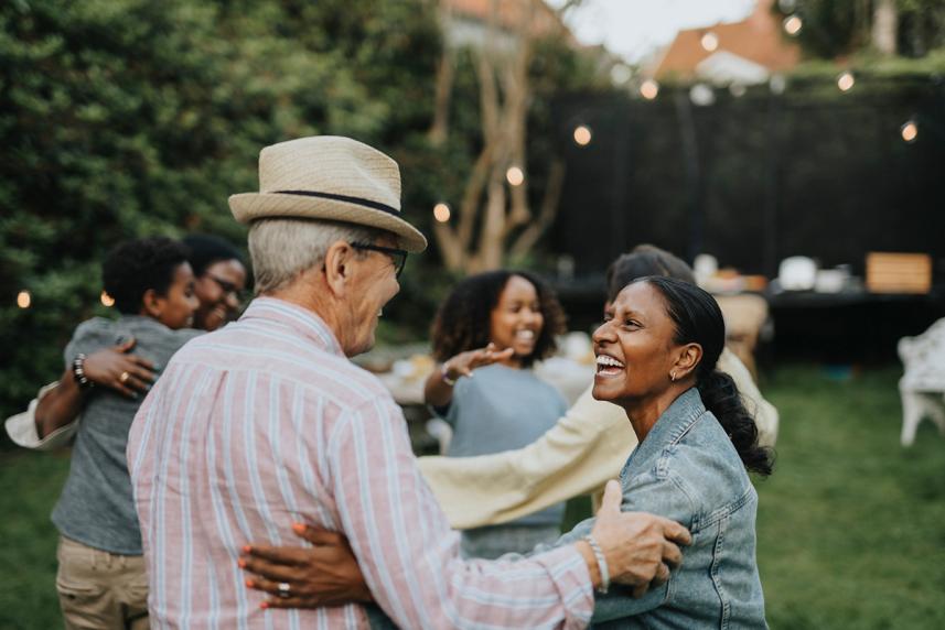 A group of people dancing together outside