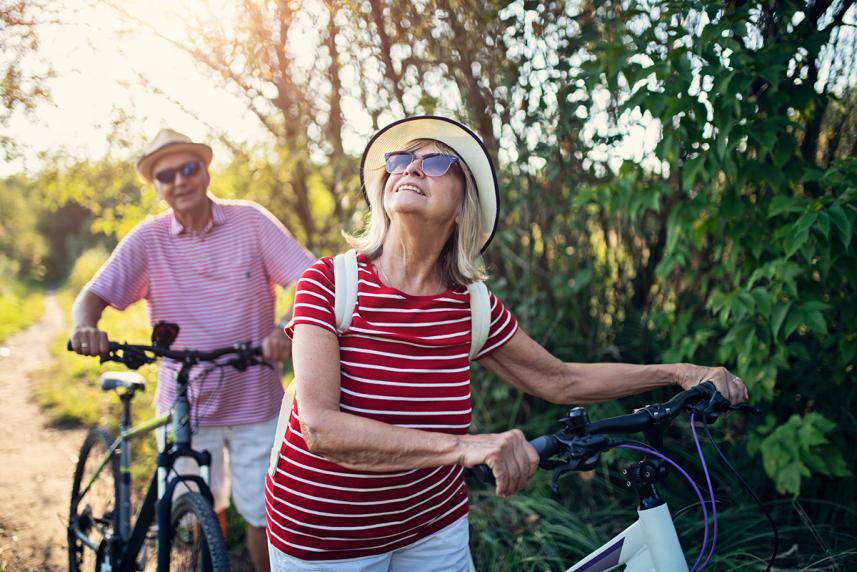 A couple walking their bikes