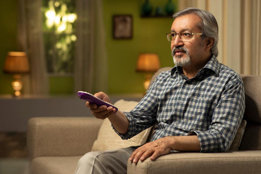 A man watching TV