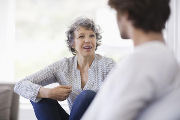 Woman smiling and talking to someone