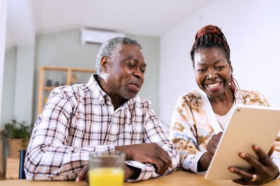 A couple looking at a tablet
